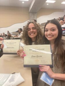 eliana with friend and certificates